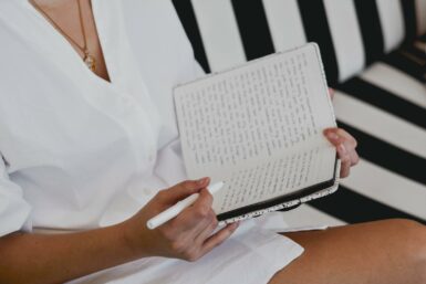 women writing in a journal 