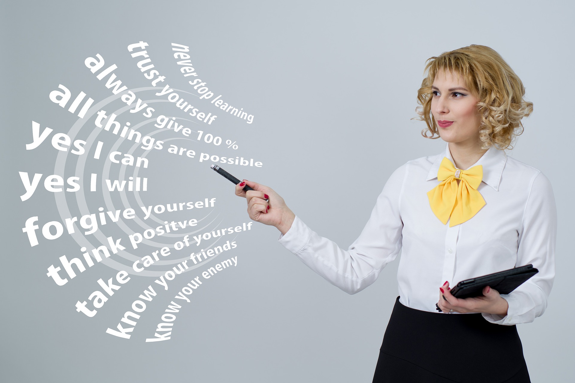 woman pointing at positive phrases